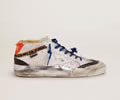 GGDB Mid Star sneakers with distressed-finish white canvas upper and multi-foxing